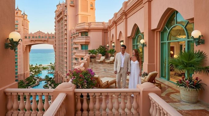 Couple in the Bahamas at Atlantis Bridge Suite balcony